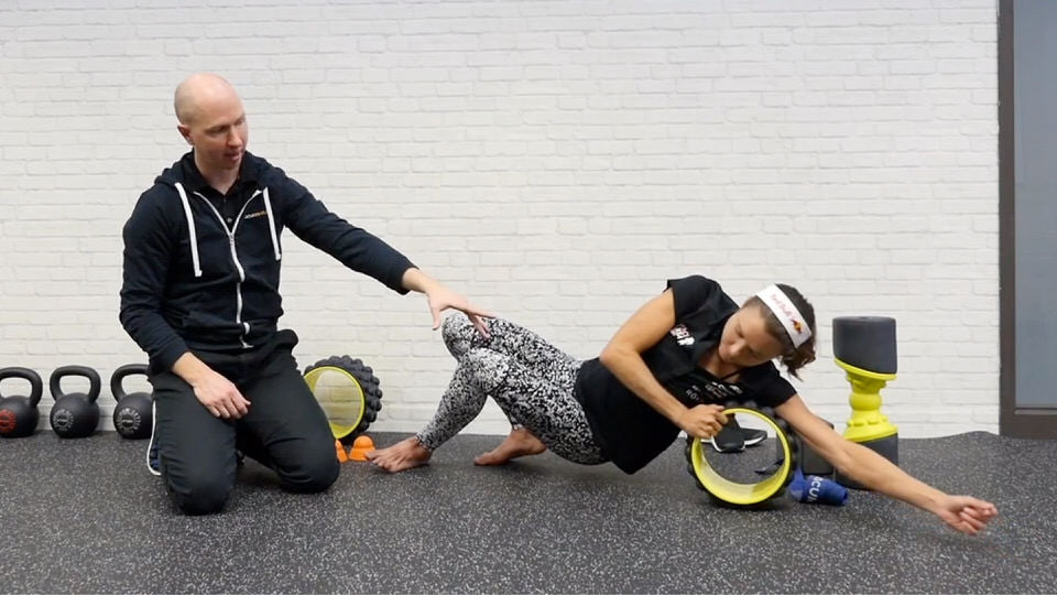 using the acumobility ultimate back roller to work trigger points in the back and shoulders for triathletes